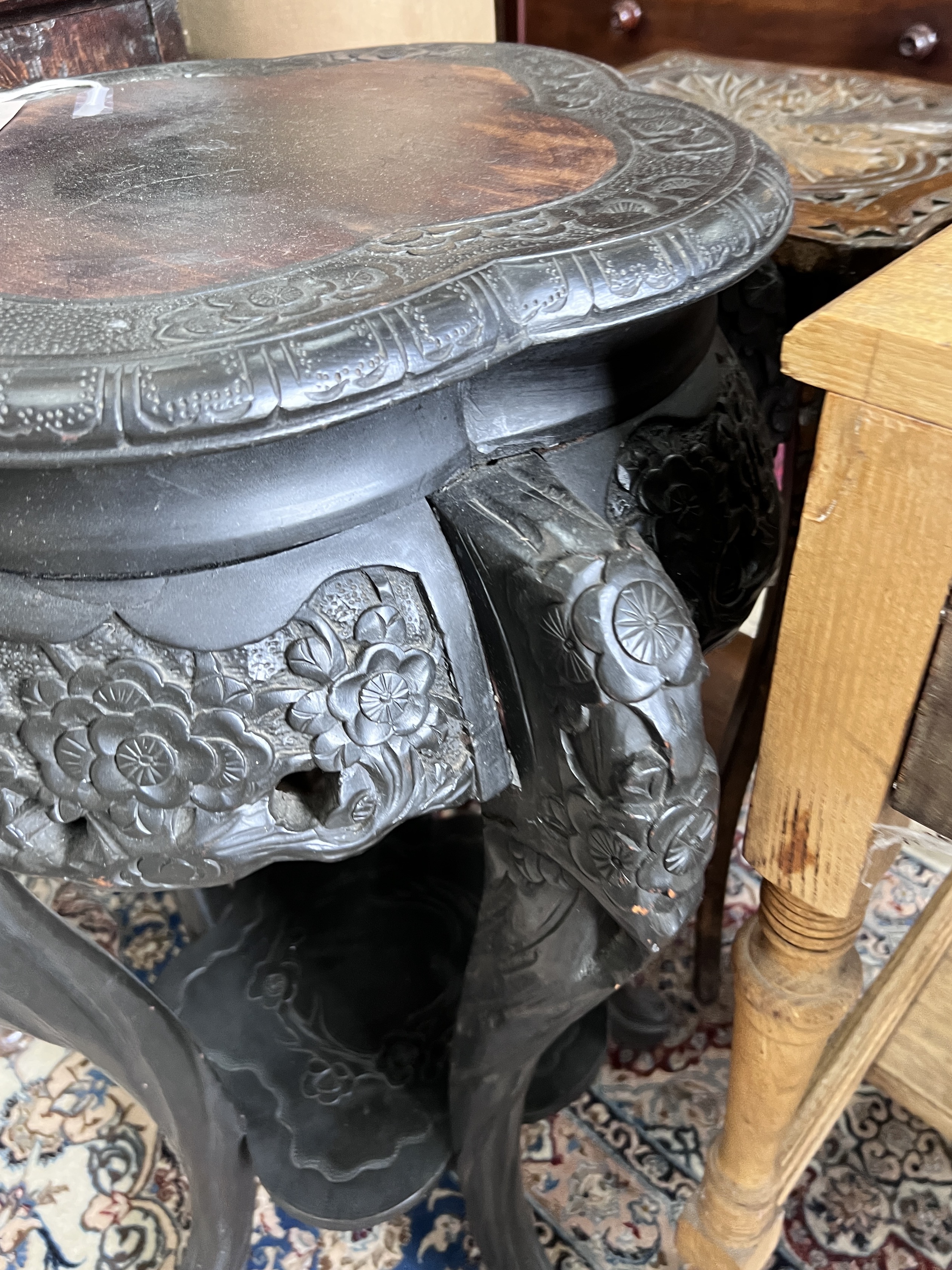 A Chinese carved two tier jardiniere stand, width 54cm, height 78cm, together with a carved beech oak two tier occasional table